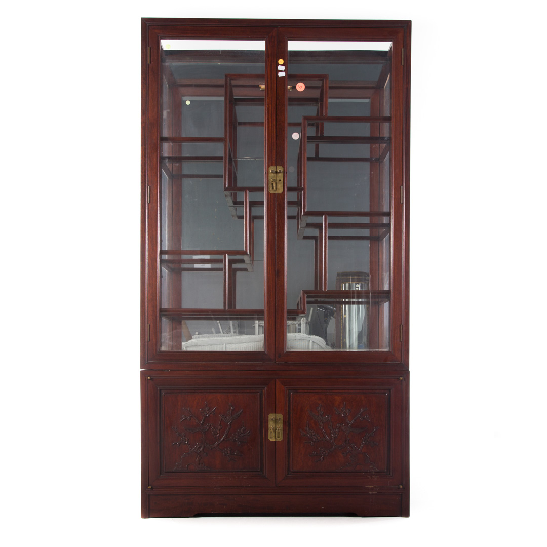 Appraisal: Chinese carved mahogany curio cabinet two parts glass panel in