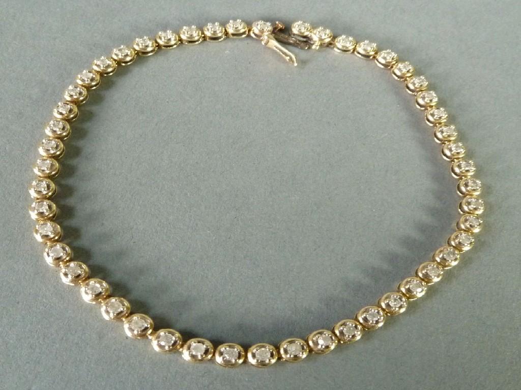 Appraisal: ct GOLD AND DIAMOND TENNIS BRACELET with fifty small diamonds