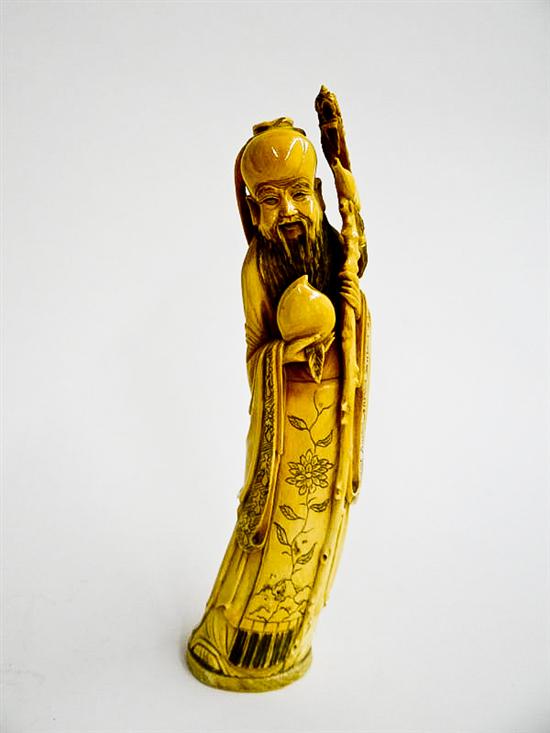 Appraisal: CARVED IVORY FIGURE China st half- th century God of