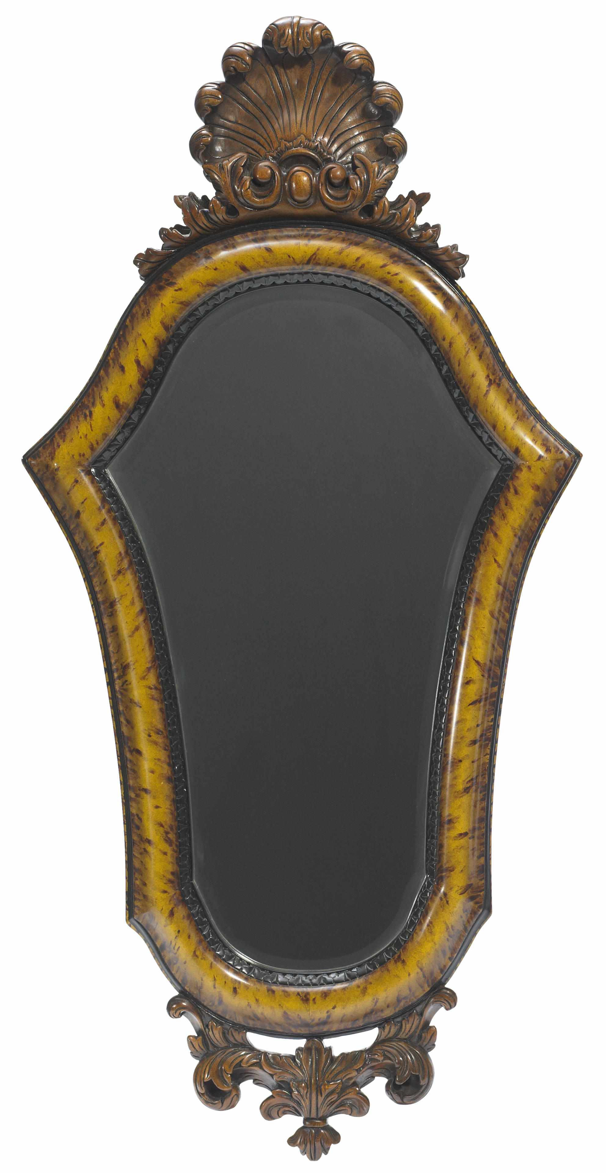 Appraisal: A Rococo style faux tortoiseshell and carved wood mirror height