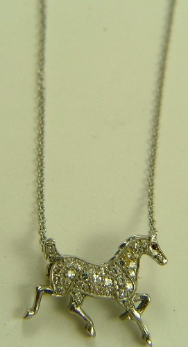 Appraisal: DIAMOND AND WHITE GOLD HORSE PENDANT BROOCH K white gold