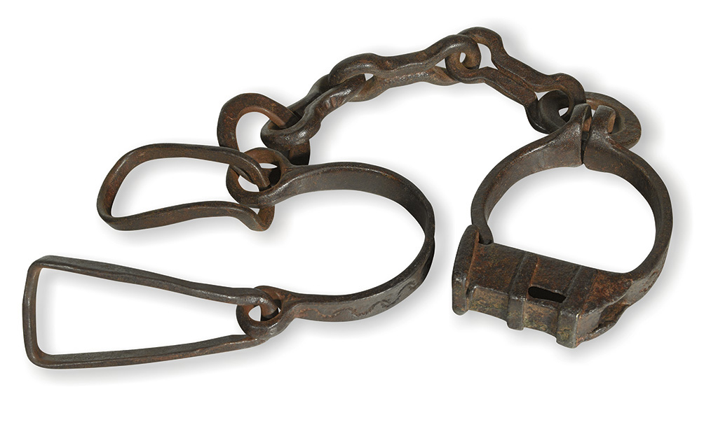 Appraisal: AFRICA Pair of elaborate wrought iron African shackles with the