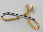 Appraisal: A yellow metal tests carat gold sapphire and diamond bracelet