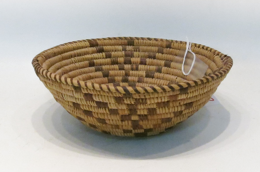 Appraisal: COILED NATIVE AMERICAN TRIBAL BASKET having two-color geometric design Diameter