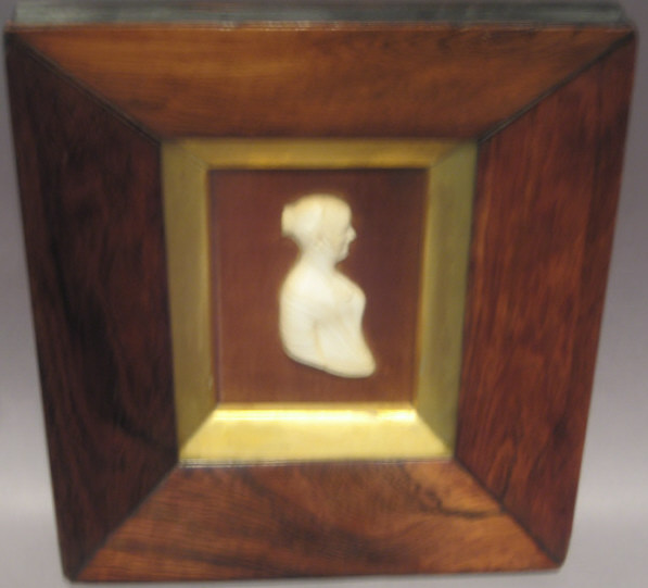 Appraisal: CONTINENTAL CARVED IVORY PROFILE PORTRAIT Waist length female framed Height