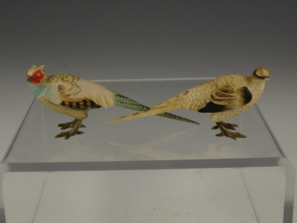 Appraisal: Pair of Chinese Ivory Long-Tailed Grouse intricate realistic carvings of