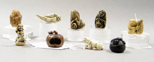 Appraisal: A group of nine netsuke of various materials th th