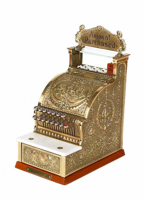 Appraisal: Reproduction embossed brass National Cash Register - with original box