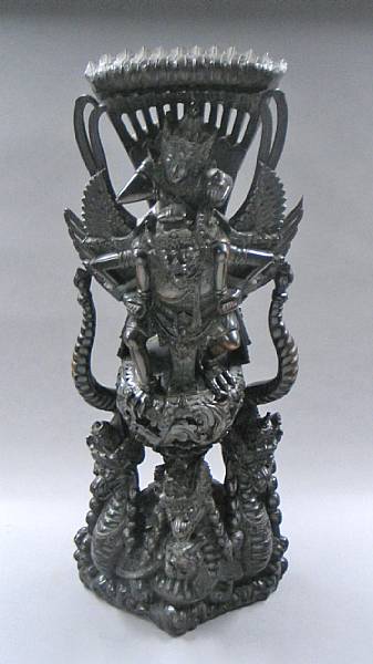 Appraisal: A southeast Asian wood carving depicting Vishnu riding upon a