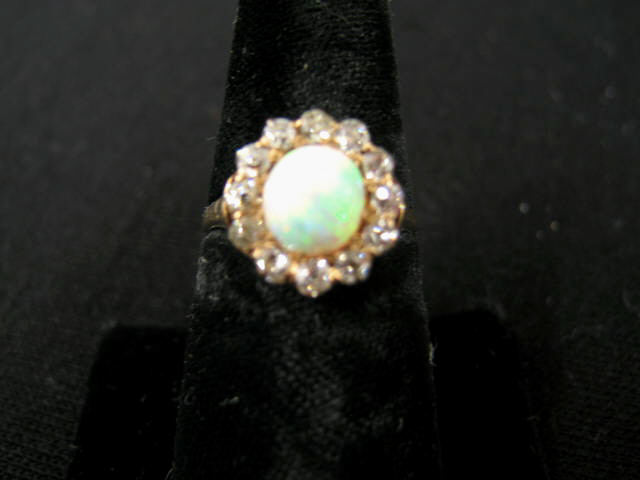 Appraisal: Opal Diamond Ring fiery mm gem surrounded by diamond totaling