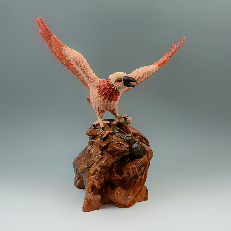 Appraisal: CORAL CLAD SCULPTURE OF AN EAGLE Body clad in carved