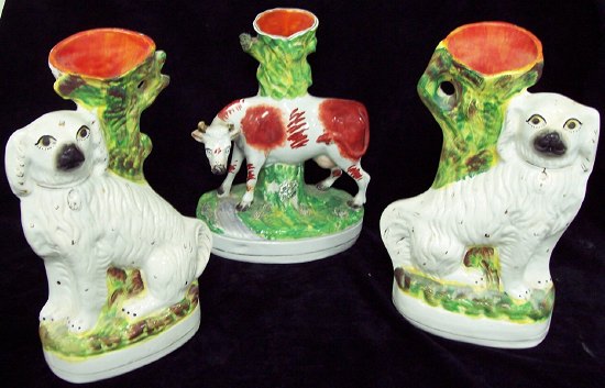 Appraisal: A pair of Staffordshire dog vases cm high together with