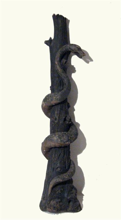 Appraisal: Large carved and painted snake and tree th century In