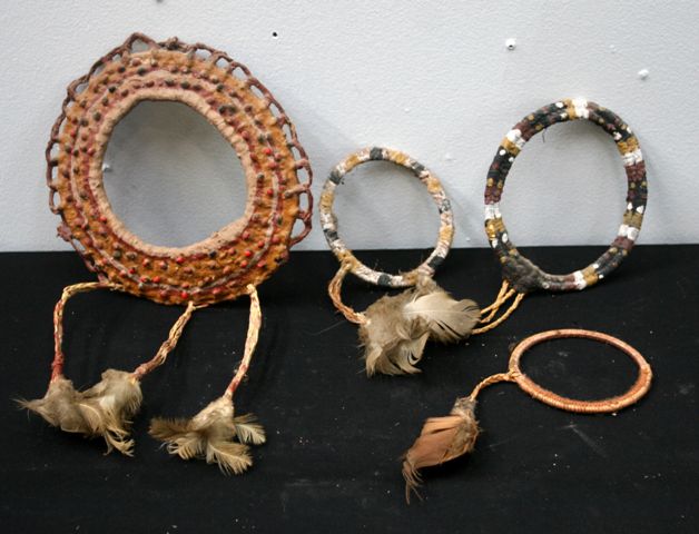 Appraisal: Four Aboriginal dance arm bands each decorated with feathers and