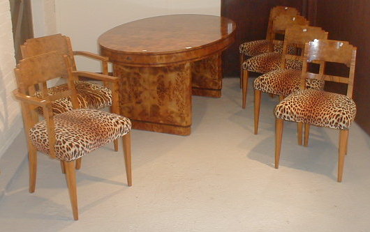 Appraisal: An Art Deco figured walnut dining table and six chairs