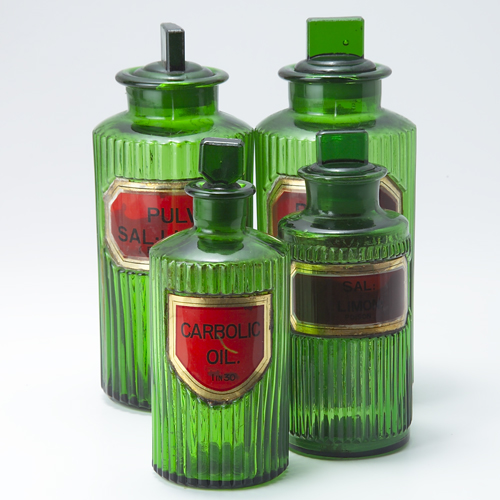 Appraisal: Four emerald green apothecary bottles with original labels and stoppers