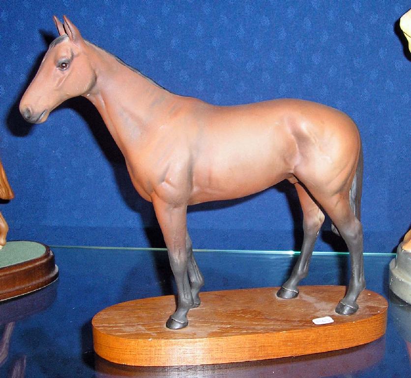 Appraisal: A Beswick model of the horse Mill Reef on wooden