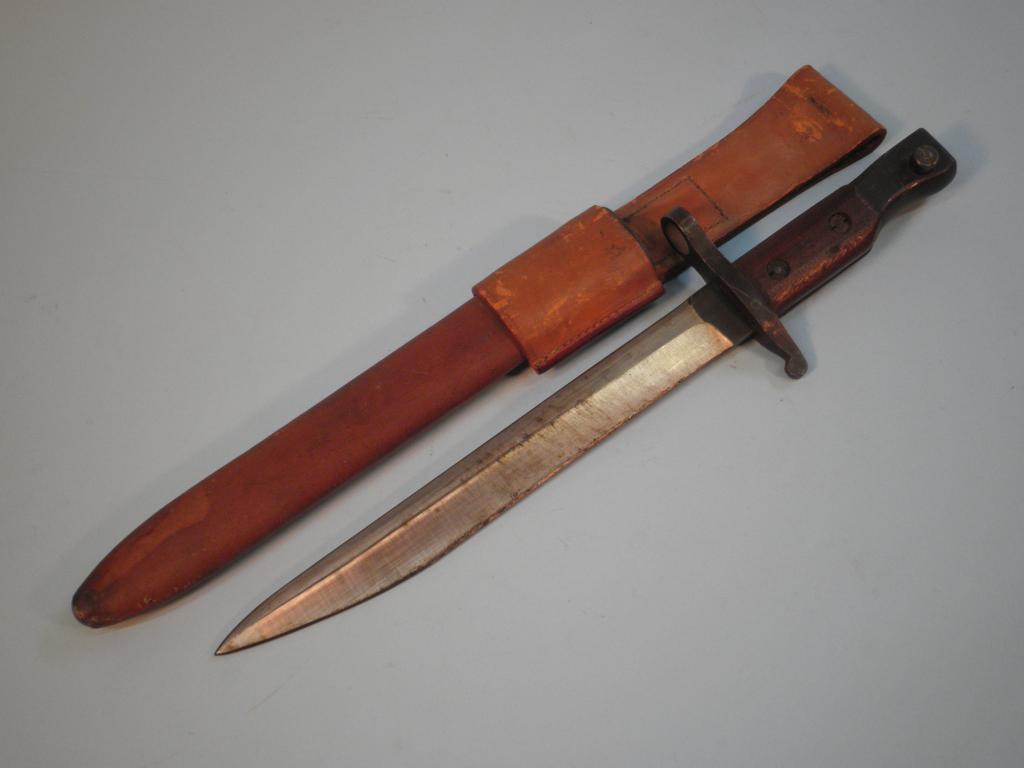 Appraisal: A British World War I bayonet and scabbard impressed with