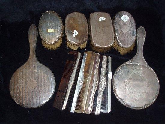 Appraisal: A quantity of silver backed hairbrushes two hand mirrors and