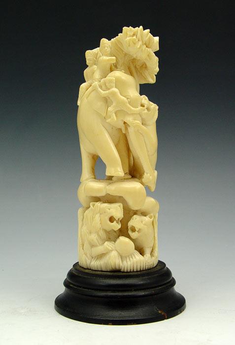 Appraisal: FIGURAL CARVED IVORY ELEPHANT TIGER ATTACK Carved from single piece