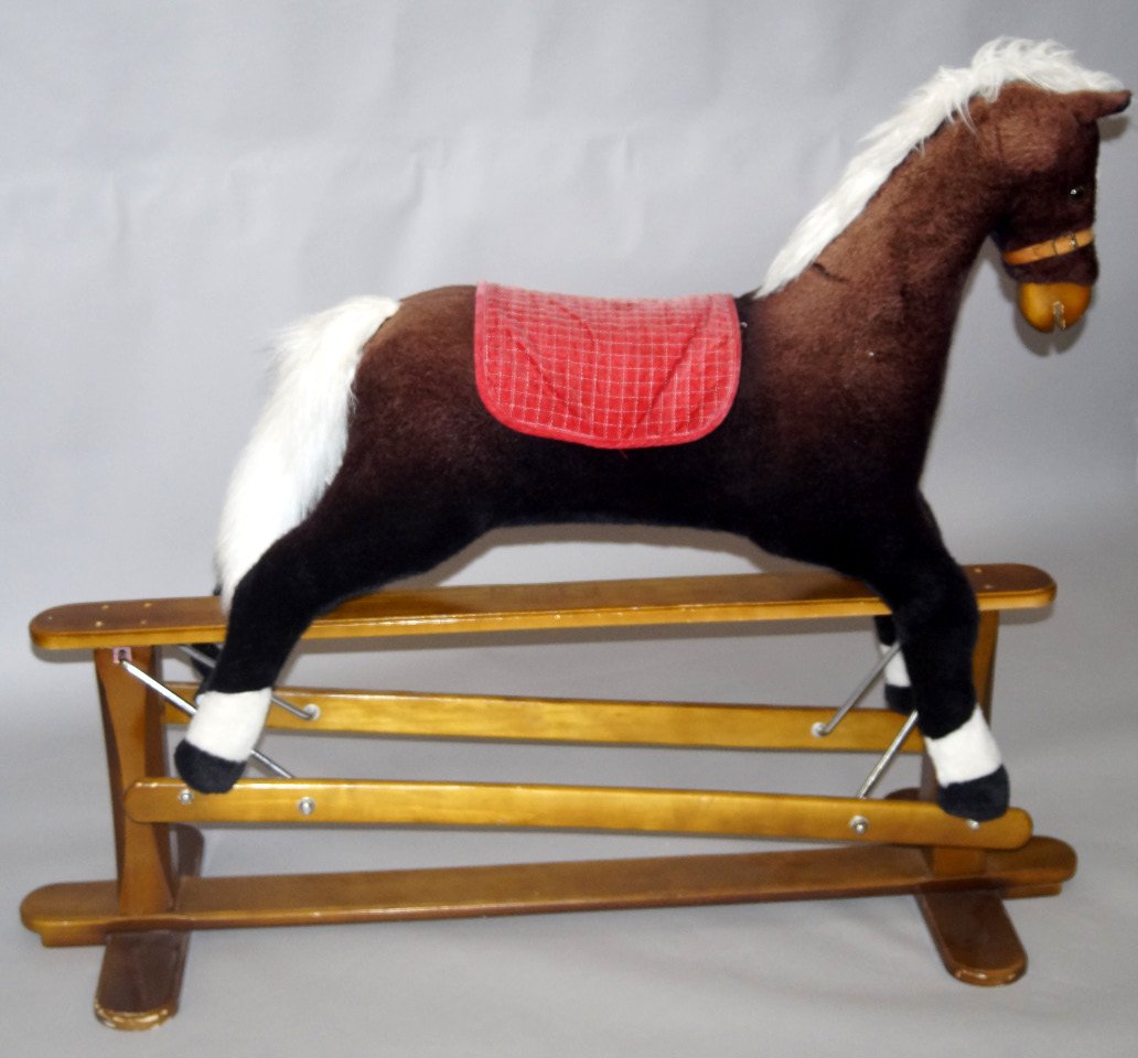 Appraisal: A Kiddicare rocking horse on a pine frame cm long