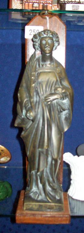 Appraisal: A cast metal model of a figure holding a palm