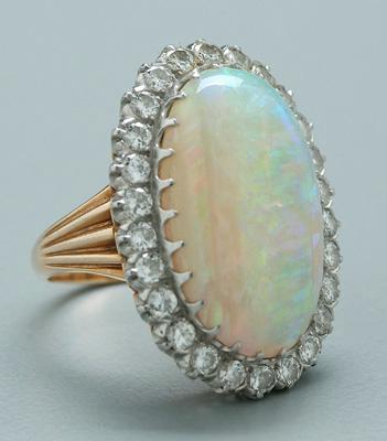 Appraisal: Opal and diamond ring fine natural semi-crystal opal oval cabochon