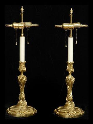 Appraisal: PAIR OF LOUIS XV-STYLE GILT-BRONZE CANDLESTICK LAMPS Each baluster twist