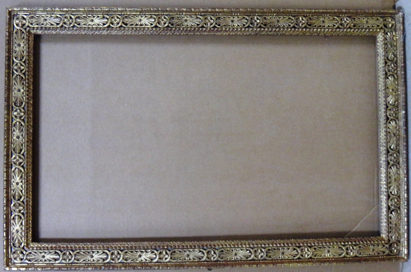 Appraisal: A th century carved and pierced giltwood frame the aperture