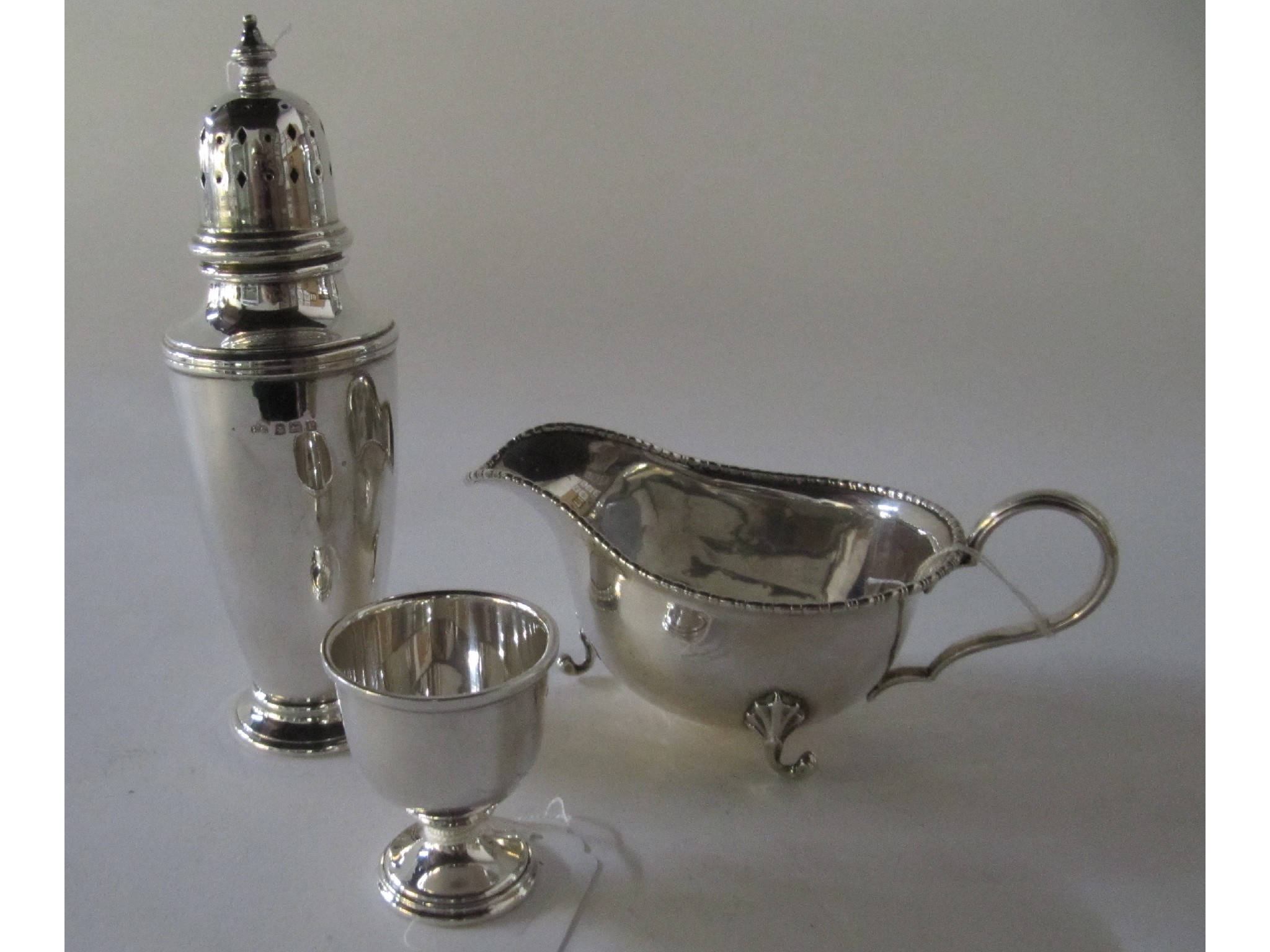 Appraisal: A lot comprising a silver sugar castor Birmingham a silver