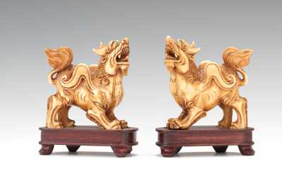 Appraisal: A Pair of Ivory Foo Lions A pair of finely