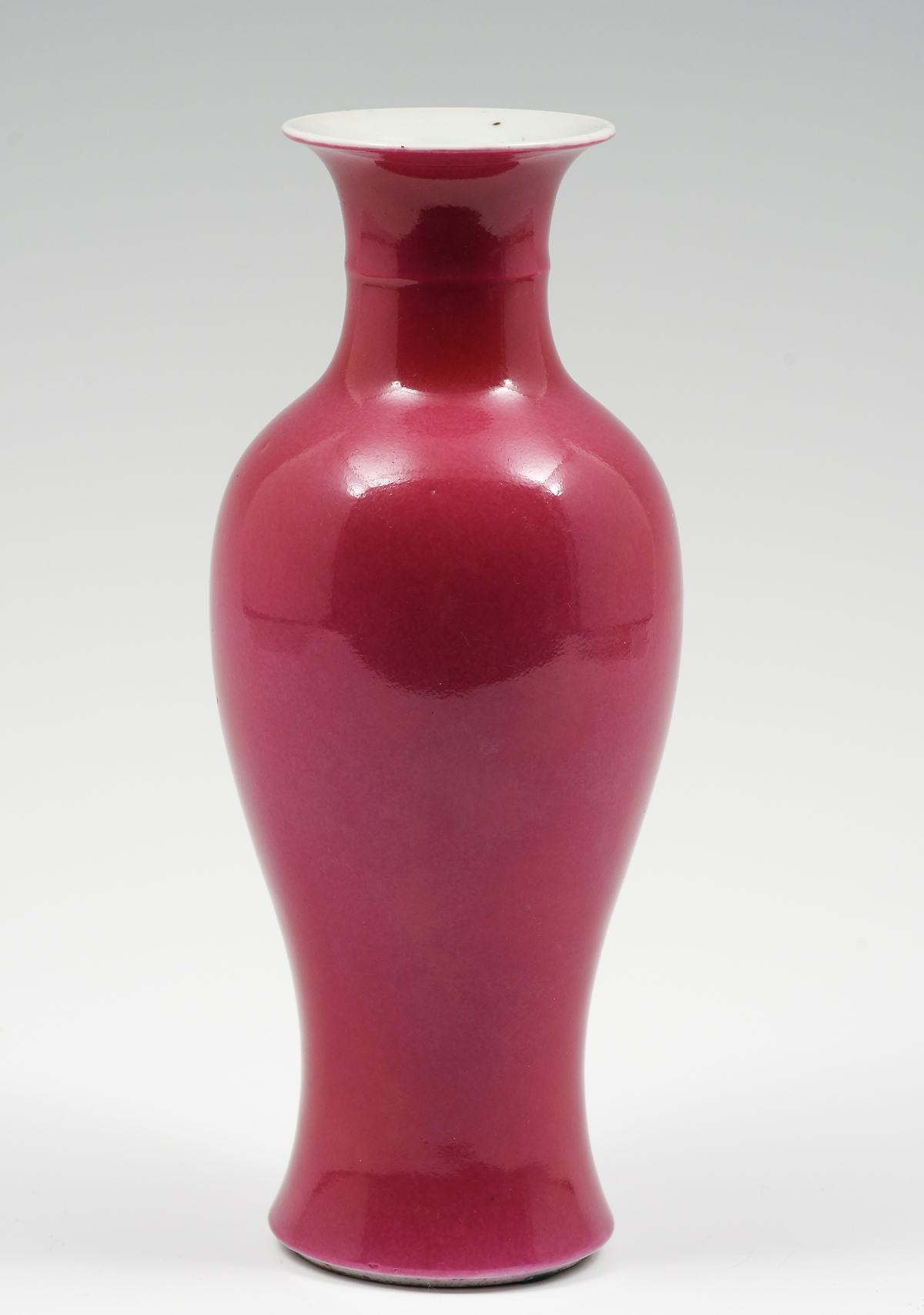 Appraisal: EARLY TH-CENTURY CHINESE MAGENTA BALUSTER VASE Duberry red glazed Chinese