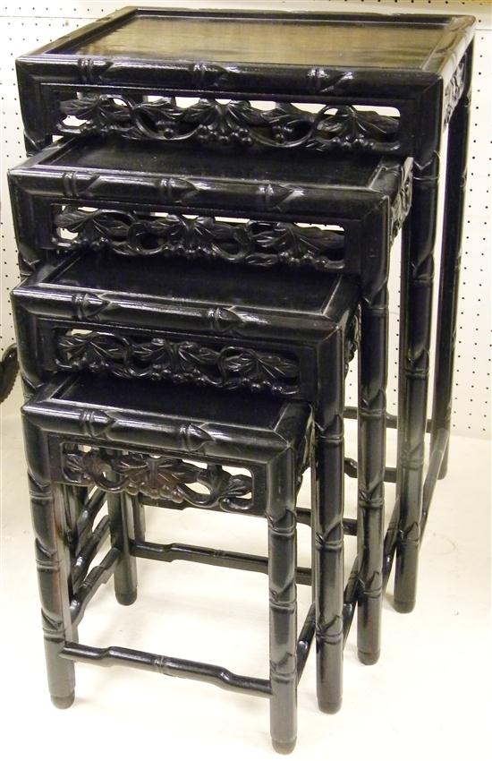 Appraisal: Carved Oriental nest of four stacking tables the largest is