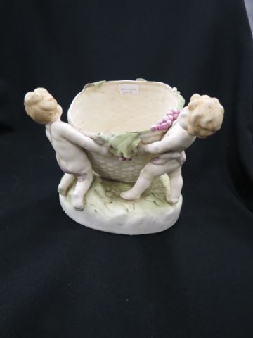 Appraisal: Teplitz Amphora Art Pottery Figural Planter children holding an oversize