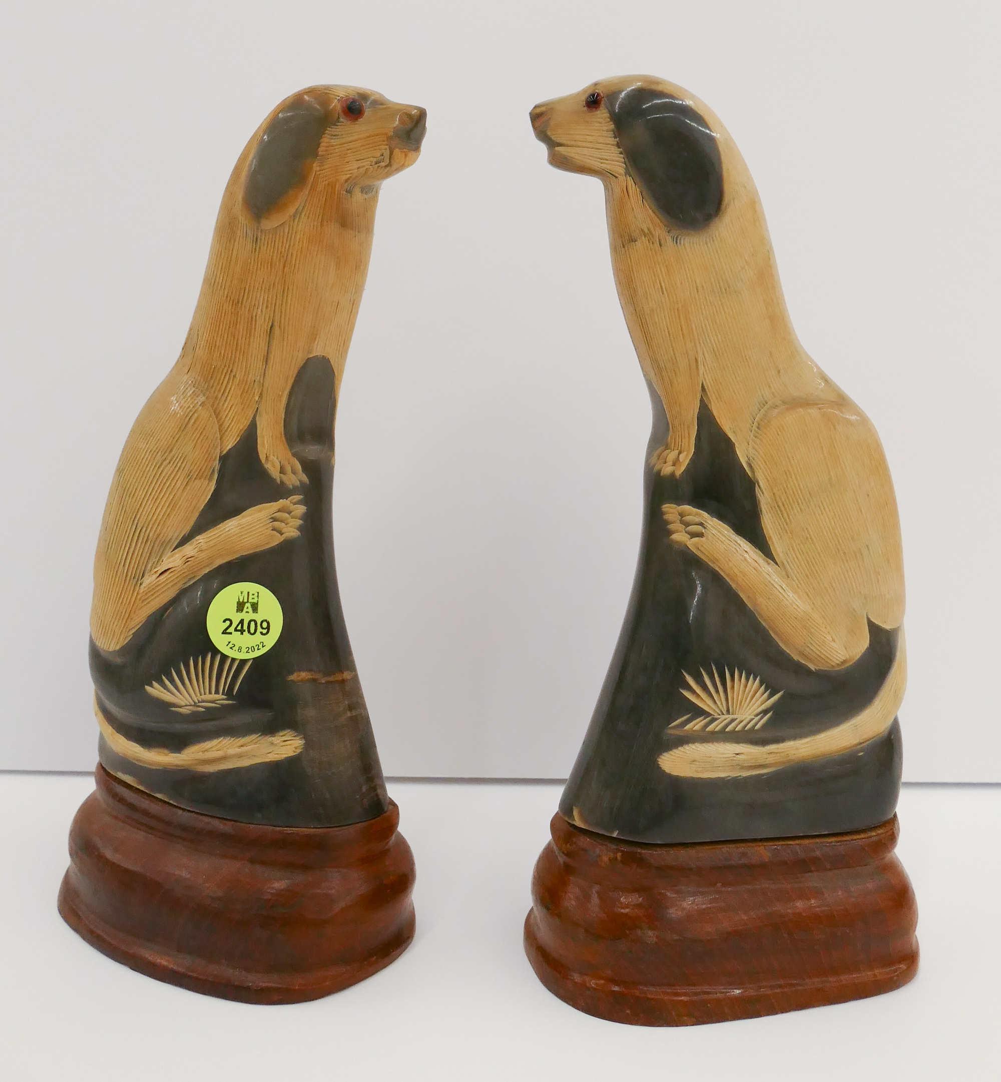 Appraisal: Pair Vintage Carved Horn Dog Figures- ''