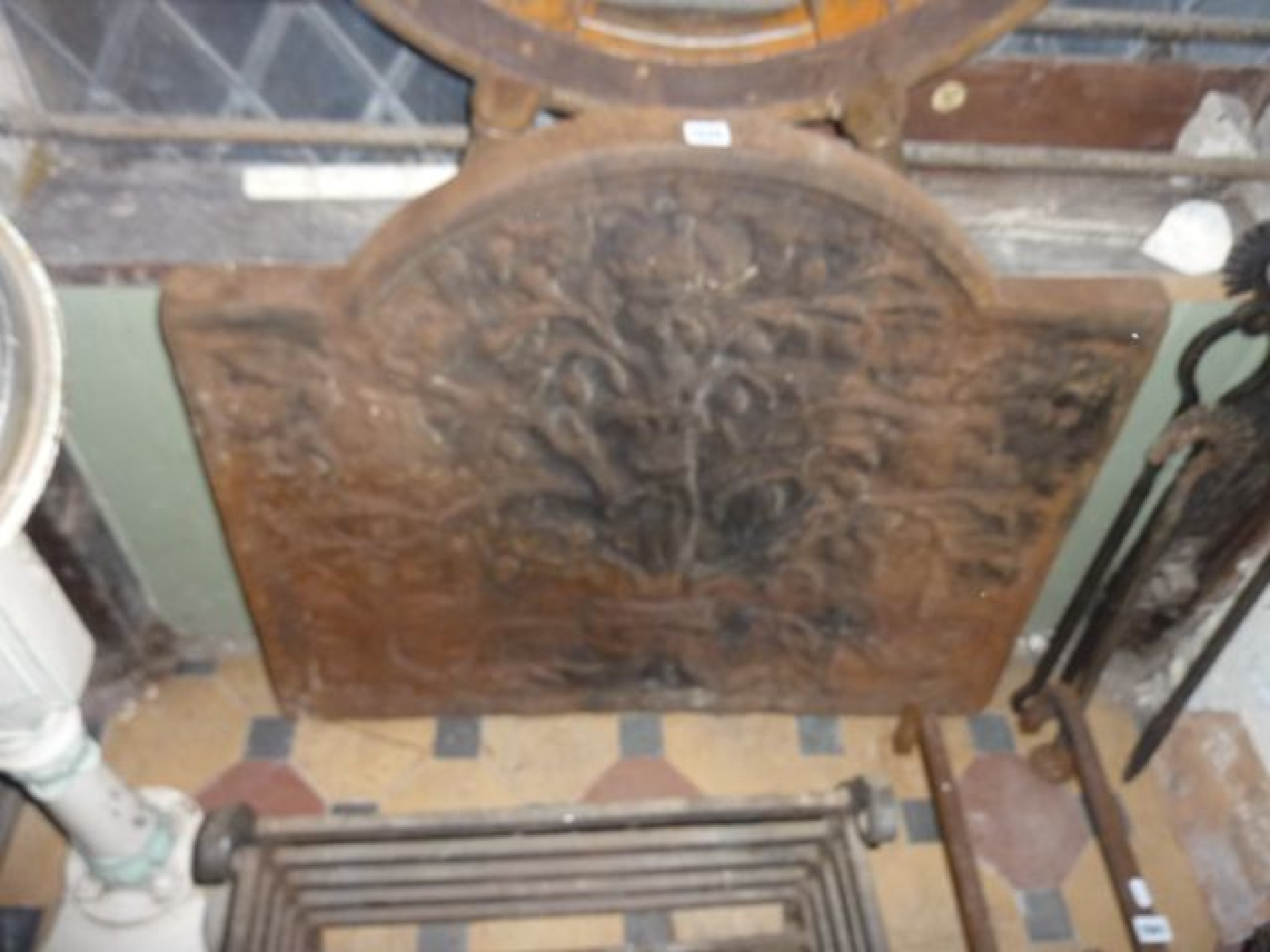 Appraisal: A substantial traditional iron fire back showing Charles I in