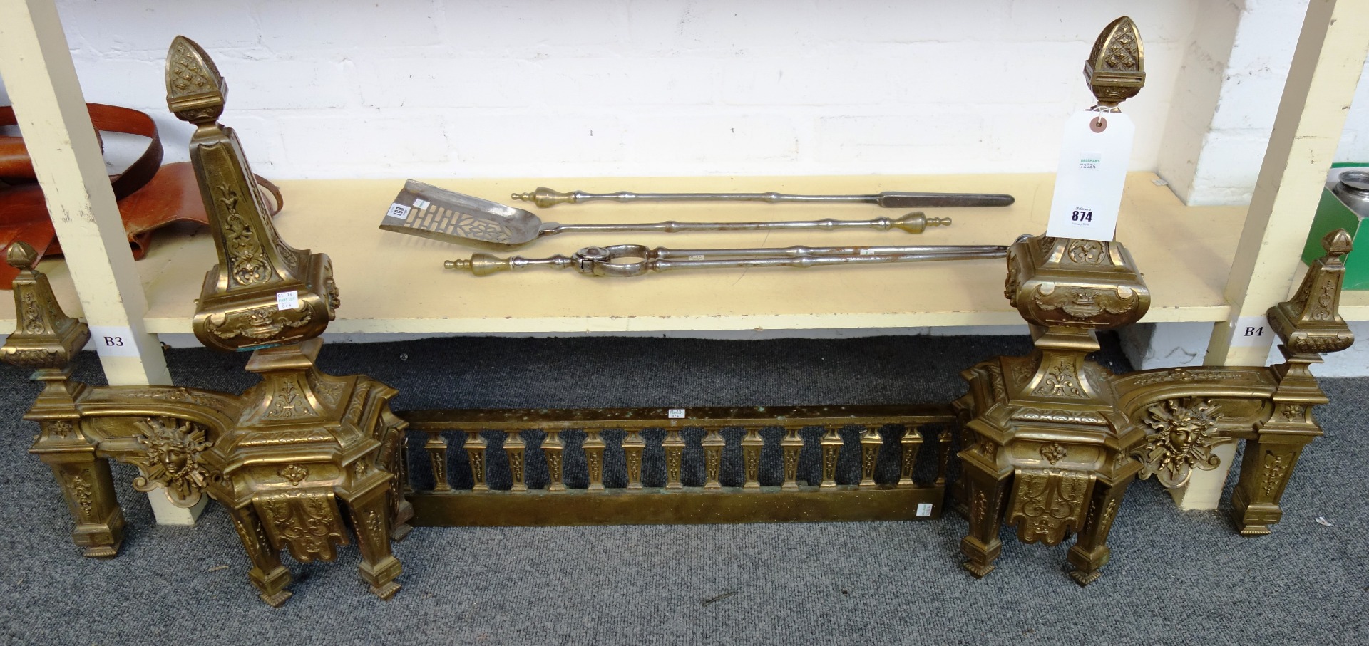 Appraisal: A Victorian gilt bronze adjustable fire kerb with twin shaped