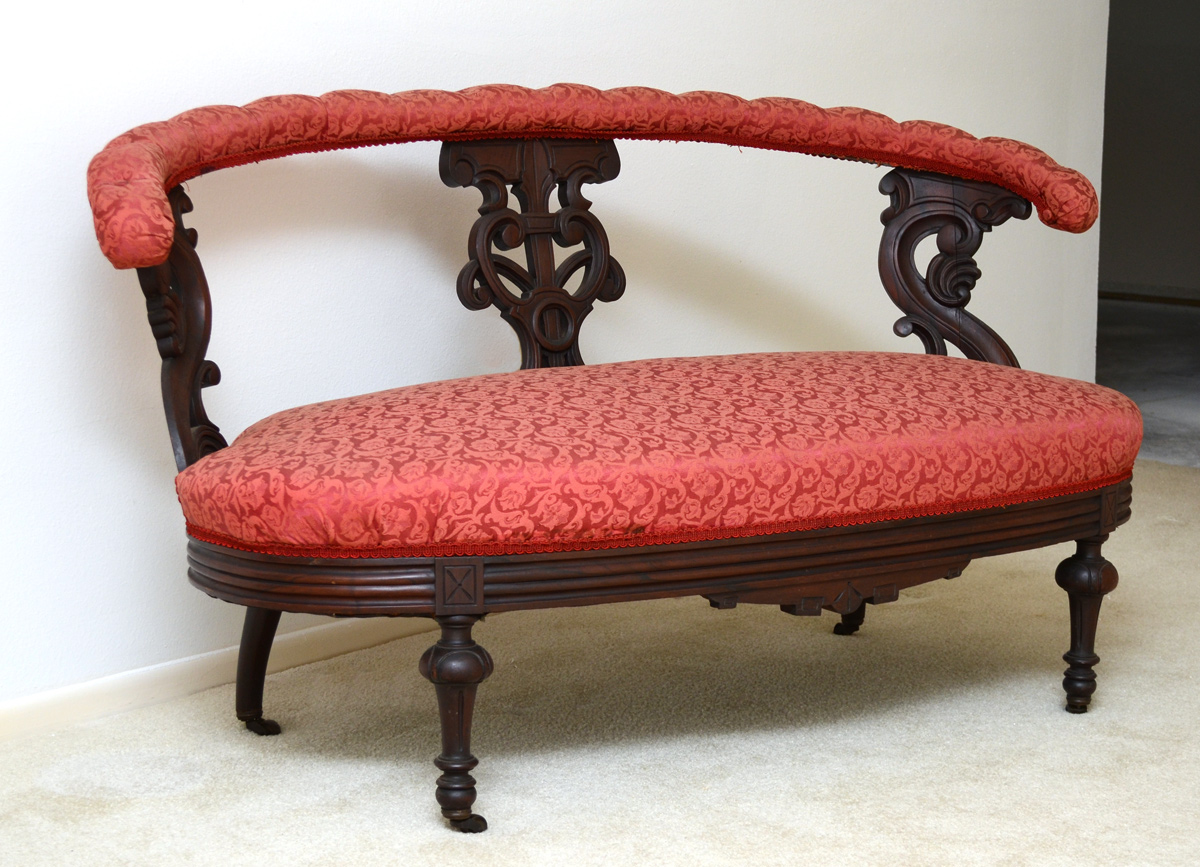 Appraisal: CARVED VICTORIAN LOVESEAT Padded and tufted top rail Carved and