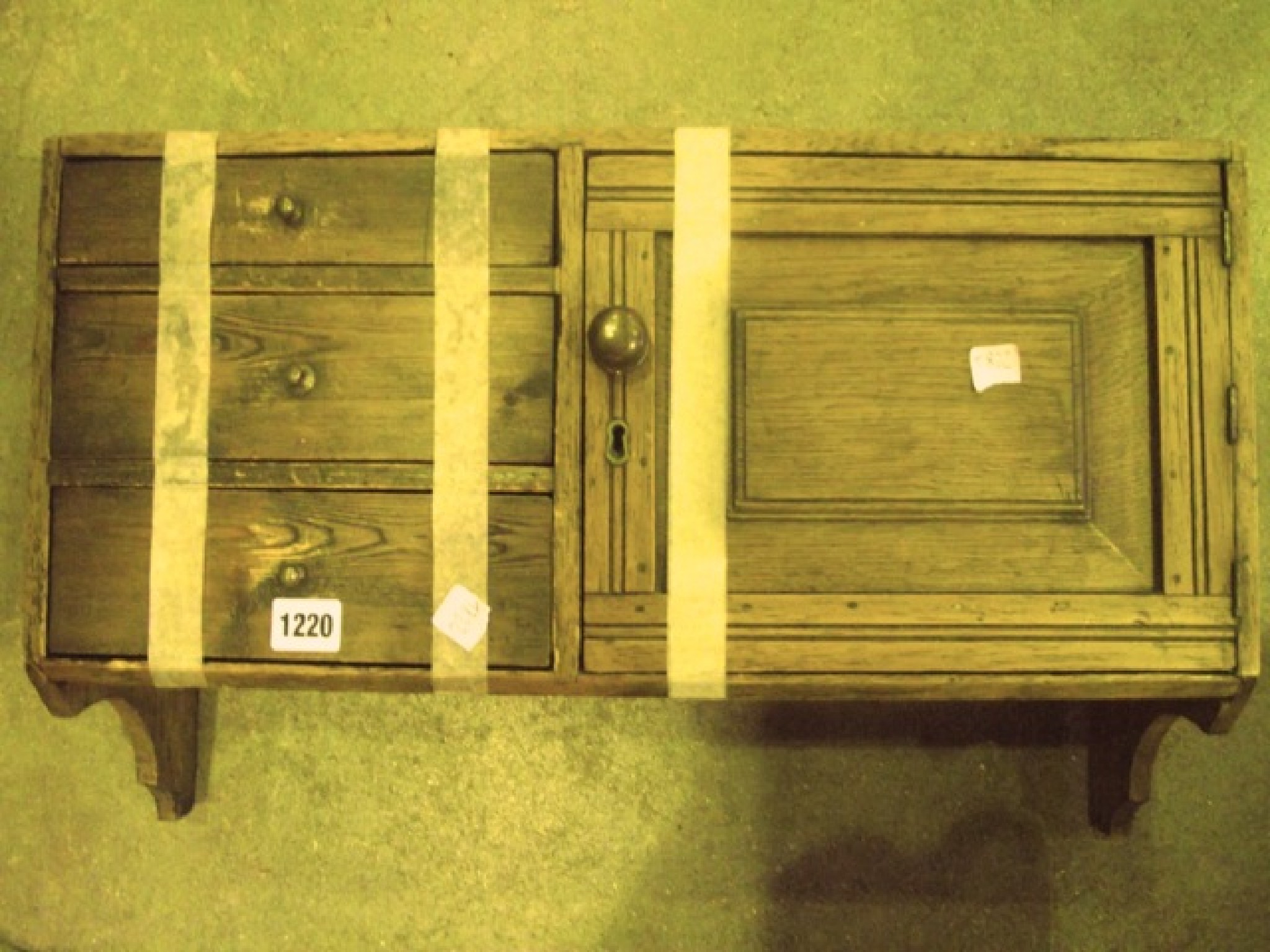 Appraisal: A small oak and pine hanging cupboard partially enclosed by