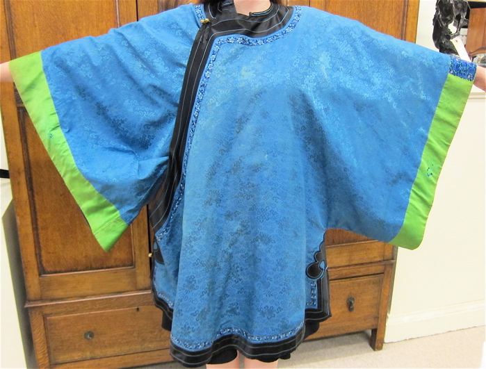 Appraisal: CHINESE BLUE SILK LADY'S JACKET ROBE the ice-blue field having