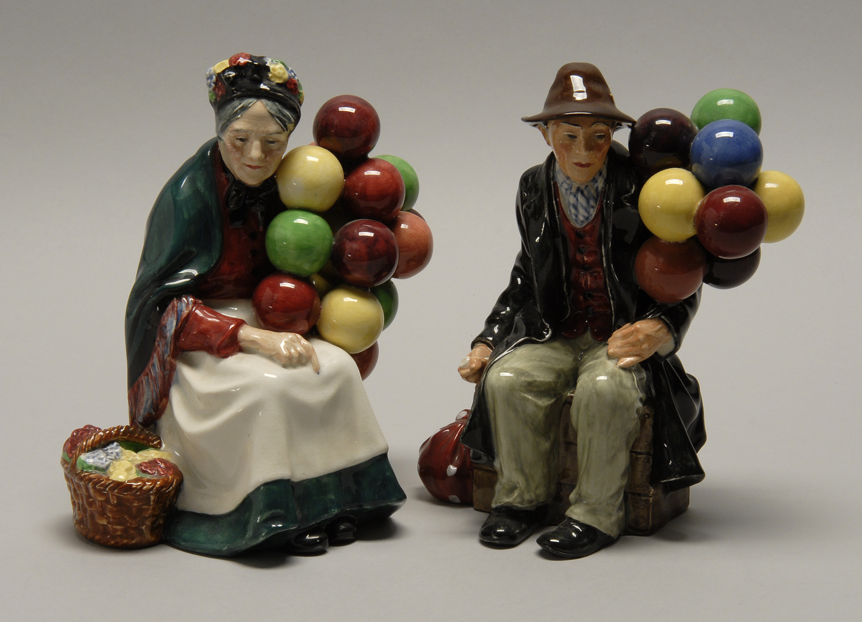 Appraisal: PAIR OF ROYAL DOULTON FIGURES OF BALLOON SELLERS English th