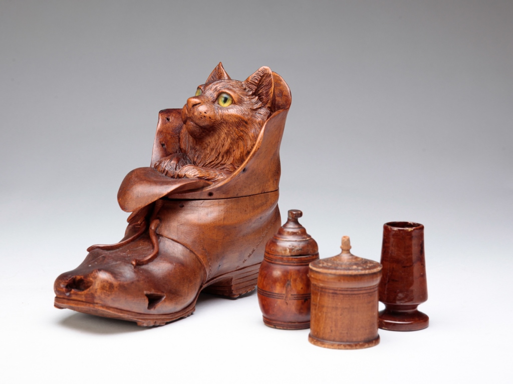 Appraisal: PUSS IN BOOTS INKWELL AND THREE TREENWARE PIECES Late th