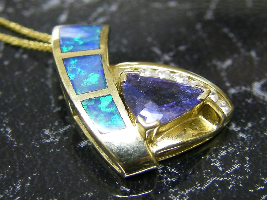 Appraisal: Modern ct pendant on trace chain set with diamonds iolite