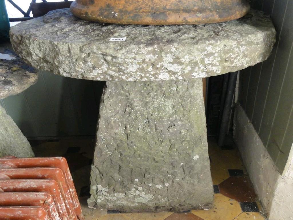 Appraisal: A substantial rough hewn natural stone staddle stone and cap