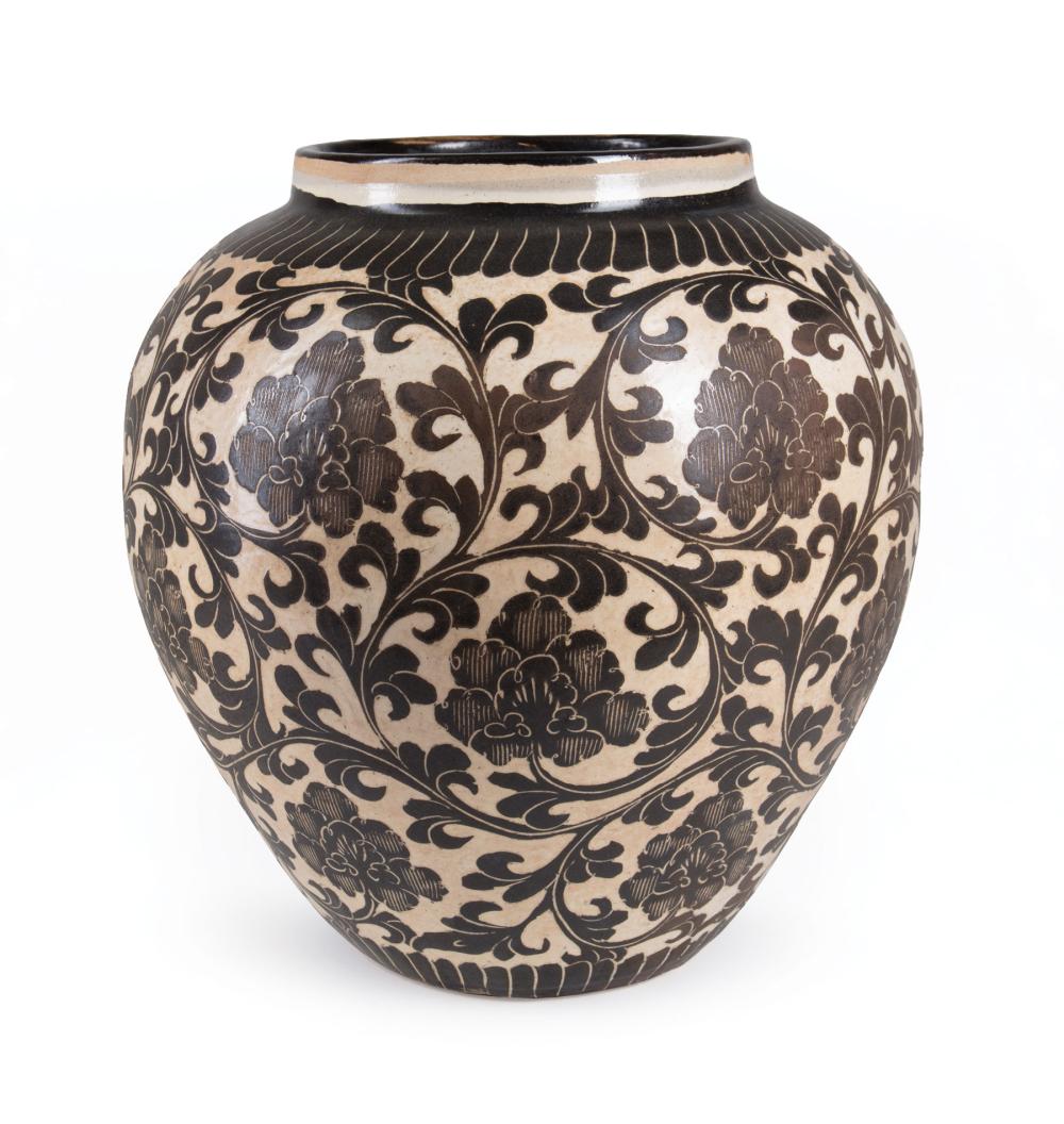 Appraisal: Chinese Cizhou-Style Pottery Jar decorated with scrolling foliage between lappet