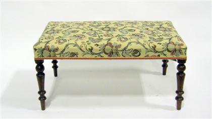 Appraisal: English upholstered mahogany bench The rectangular tapestry upholstered top raised