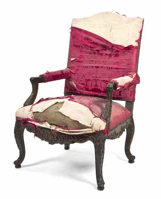 Appraisal: A Victorian Carved Open Armchair having an upholstered back arms