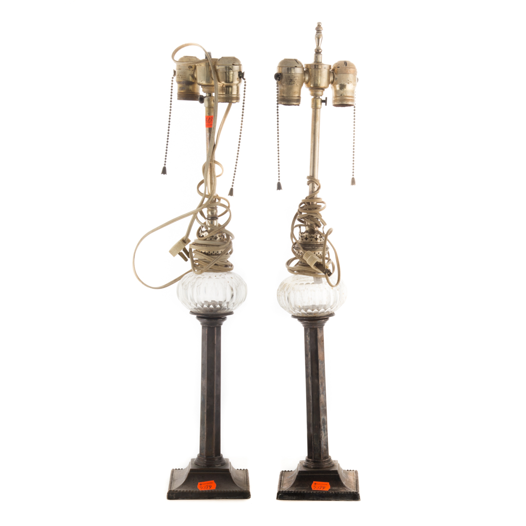 Appraisal: Pair of silver-plated candlesticks mounted as oil lamps Condition lamp