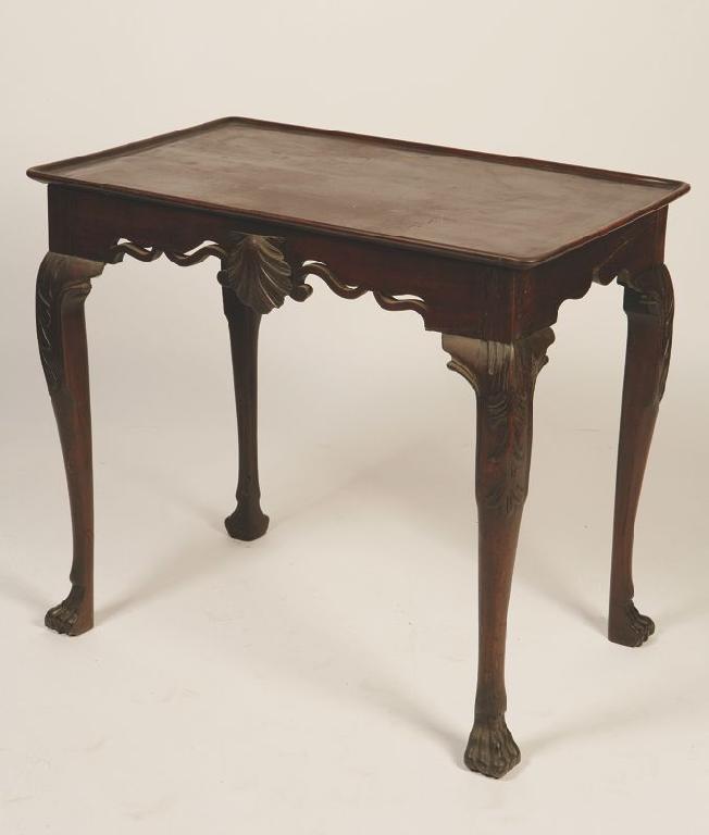 Appraisal: A GEORGE II IRISH MAHOGANY SILVER TABLE the rectangular dished