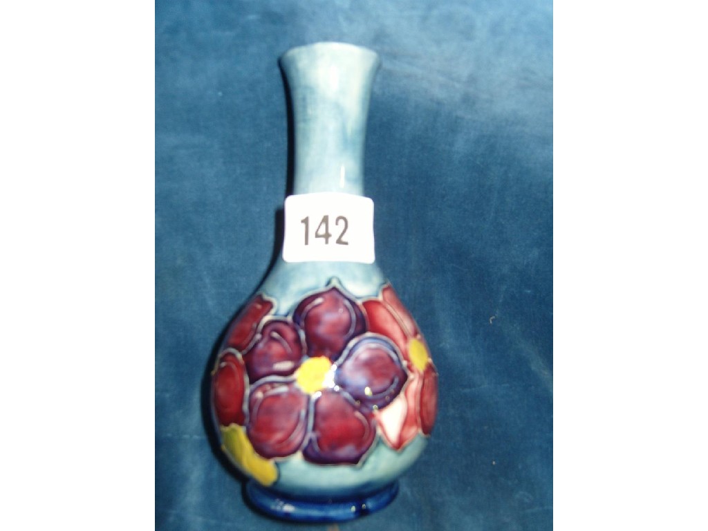 Appraisal: A blue ground Moorcroft vase of bottle shaped form with